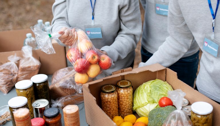 Grocery order being packed into a box
