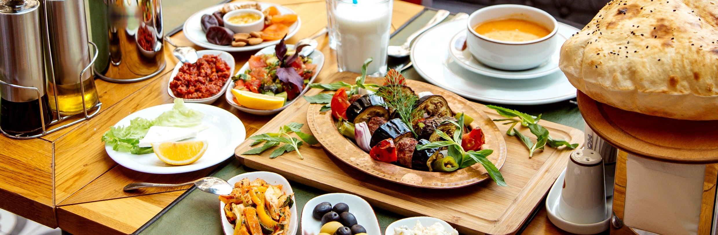A restaurant table laid with plates of food